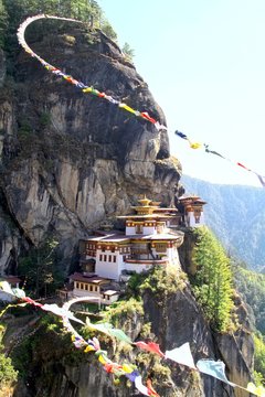 Taktshang Goemba or Tiger's nest monastery with colorful Tibetan prayer flags, Paro, Bhutan.