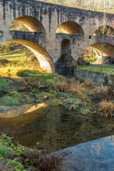 Fototapeta na wymiar Alte Steinbrücke über die Tauber im fränkischen Taubertal