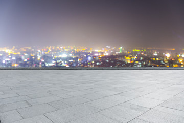 Panoramic empty floor with modern business office building at night