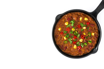Traditional mexican tex mex chili con carne in a frying pan isolated on white background
