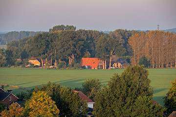 Naklejka premium High angle view of farmland at edge of dutch rural village.