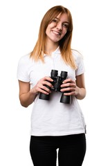 Happy Beautiful young girl with binoculars