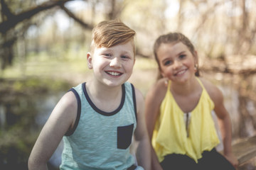 Portrait of a little girl on a yellow background. with his friend