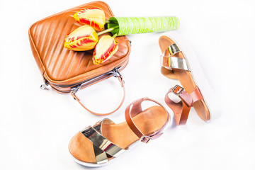 Brown women bag sandals and tulips