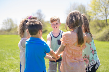 Group of child have fun on a field together