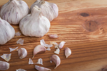 Garlics and bulbs on wooden table