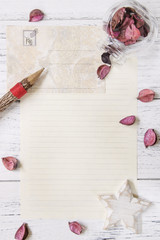 Flat lay stock photography purple flower petals letter envelope paper glass bottle wood pencil star craft