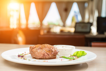 Hot dish steak on the table in a restaurant