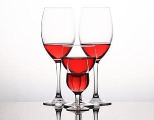 Wineglasses with red wine isolated on white background
