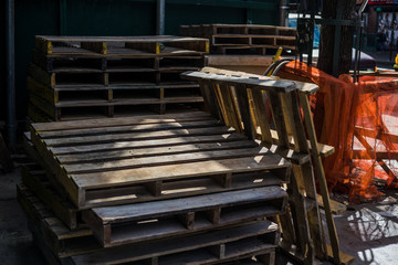 Pallets stacked on New York City street near construction site