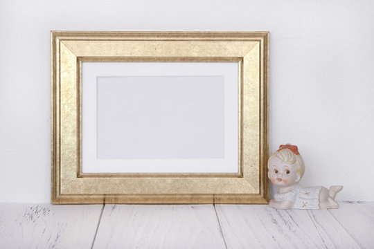 Stock photography golden picture frame cute baby girl doll mock up for text message