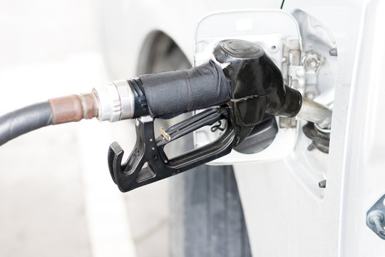 The Self Pumping Gasoline Fuel In Car At Gas Station