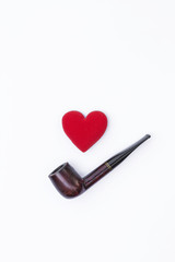 Antique wooden pipe with red heart on white background, Father's day concept