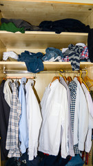 View of a man's chaotic closet