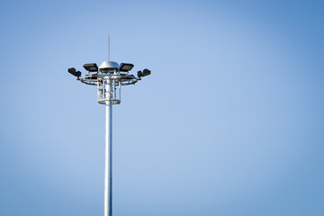 spotlight pole on blue sky background