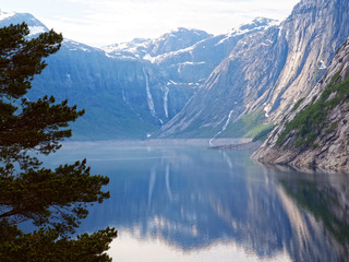 Fototapeta na wymiar The lake and the waterfall under Trolltunga in Norway - views while hiking toTrolltunga, Scandinavia