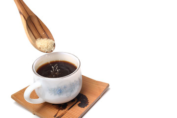 pour sugar on coffee cup