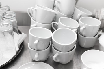 Cups and glasses on a restaurant kitchen. Selective focus. Shallow depth of field