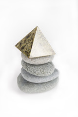 Stack of gray stones on a white background