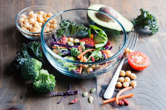 Chickpea and veggies salad, kale, broccoli, goji berries, healthy homemade vegan food, vegetarian diet, vitamin snack
