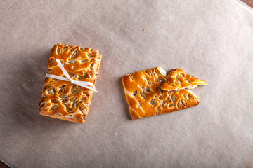 Cookies with seeds tied with a ribbon on light background