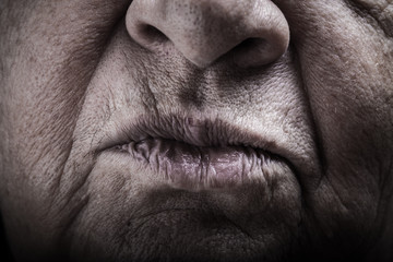 Part of portrait of elderly woman. Mouth. Toned