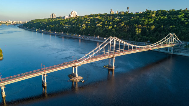 Aerial top view of pedestrian Park bridge and Dnieper river from above, city of Kiev, Ukraine
