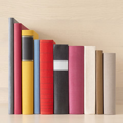 stack of new colorful books in the bookself - 156623350