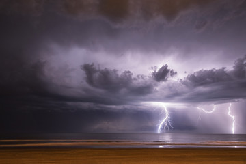 Lightning on the sea from the beach