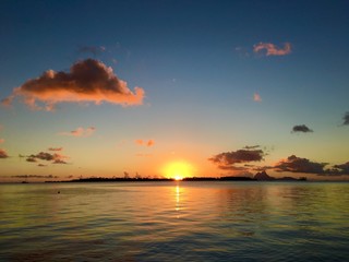 Beautiful sunset a Tahaa with a view on the Motu Tautau and Bora Bora in the background, Tahaa, Tahiti, French Polynesia