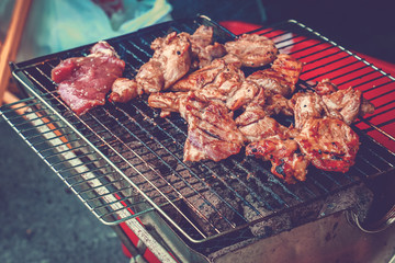 Grilled pork on the grill.