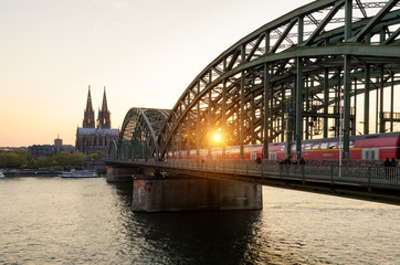 Cologne, Germany. Image of Cologne with Cologne Cathedral and railway during sunset in Germany.