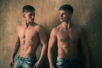 Fototapeta na wymiar men posing with strong, naked torso