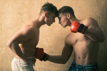 boxers men twins, fighting with gloves and fists