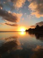 Fototapeta na wymiar Beautiful sunset at the beach of Atimaono, Tahiti, French Polynesia