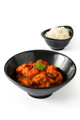 Chicken tikka masala in bowl isolated on white background
