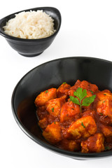 Chicken tikka masala in bowl isolated on white background
