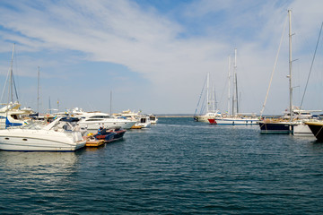 Fototapeta premium Yacht seaport, landscape view. Blue sky, summer tourism