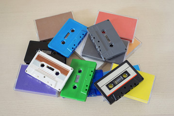 Retro colorful audio tapes and cases on the table