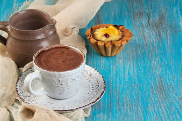 Cup of coffee on blue background