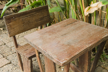 Fototapeta premium Old wooden table in the garden
