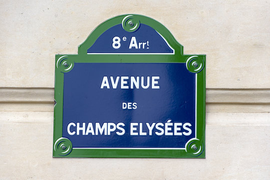 Fototapeta Street sign of the rue Champs-Élysées in the 8th arrondissement of Paris, France.