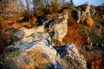 Rocky landscape during autumn. Beautiful landscape with stone, forest and fog. Misty evening autumn landscape. Landscape with rock hills.