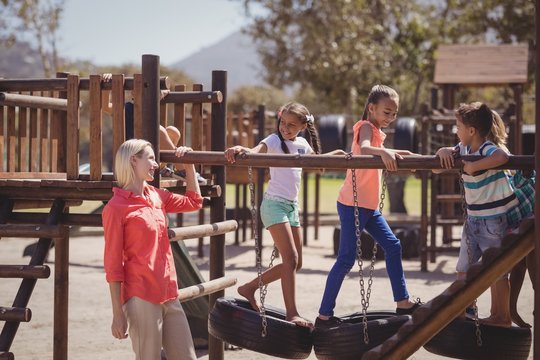 Trainer interacting with schoolkids