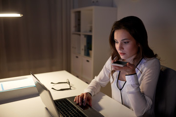 woman using voice command recorder on smartphone