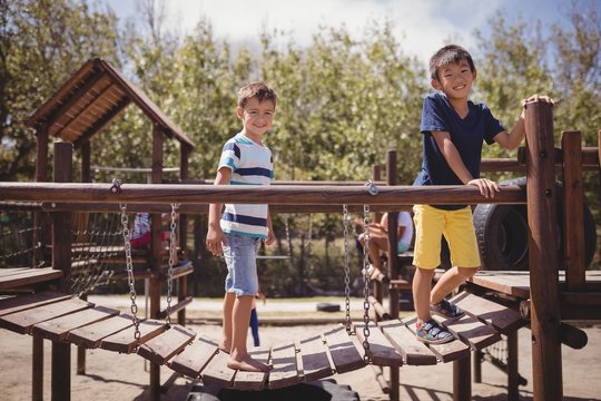 Happy Schoolkids Playing In Playground