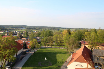 Fototapeta premium Aerial view over the center of Cesis old town of the Western Tower of the Cesis Castle. View on old street in Cesis city. Latvia, Europe. 