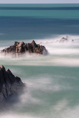 Misty Water around Rock Formations- Sea in Devon, UK