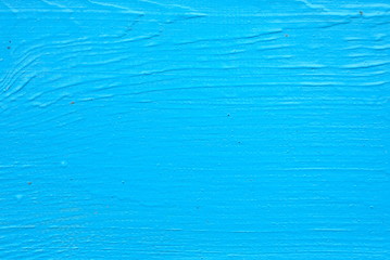 Vivid blue background, painted boards