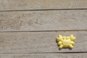 Children beach toy isolated on wood background